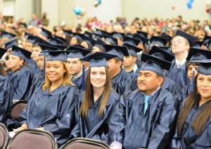 Students at Central Carolina Community College’s Jan. 16 Adult High School/General Educational Development graduation smile during the event in the Dennis A. Wicker Civic Center. More than 400 students completed their studies in the fall, the largest graduating class, by far, for adult education in the college’s history. About 250 of the graduates attended the exercises. For more information about Central Carolina Community College’s AHS/GED 