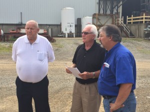 The Godwin Group founder Pat Godwin Sr., (white shirt)  Architect Joseph Sekely III (black shirt), and Galion-Godwin general  manager Carl Wilson (blue shirt), discussing construction.